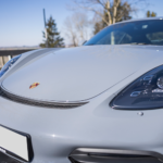Left front Porsche Cayman GT4 on Lake Constance
