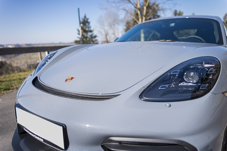 Left front Porsche Cayman GT4 on Lake Constance