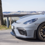 Side view Porsche Cayman GT4 on Lake Constance