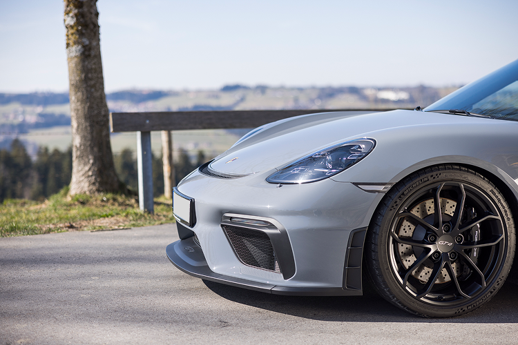 Side view Porsche Cayman GT4 on Lake Constance