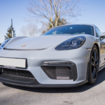 Front view a Porsche Cayman GT4 on Lake Constance