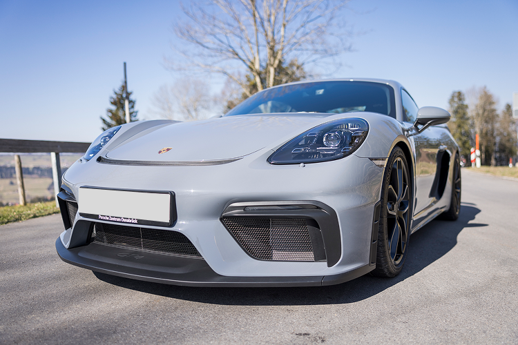 Front view a Porsche Cayman GT4 on Lake Constance