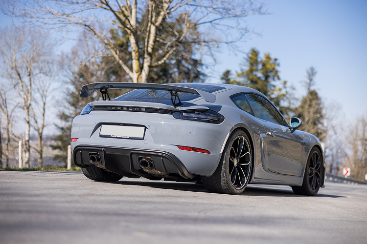 Back view Porsche Cayman GT4 on Lake Constance