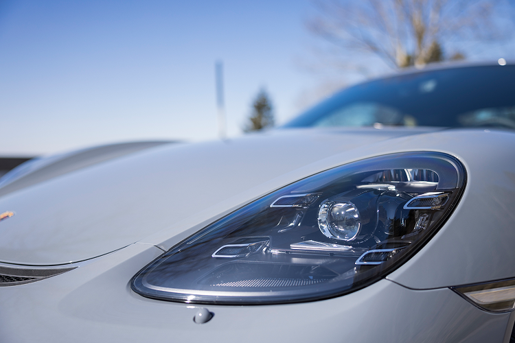 Light Porsche Cayman GT4 on Lake Constance